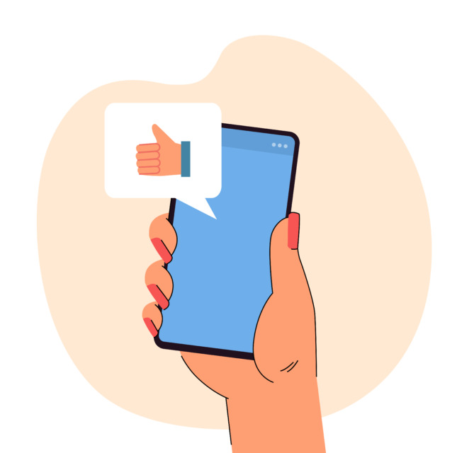 Roka drži pametni telefon, nad njim je oblaček z ikono “všeček”.